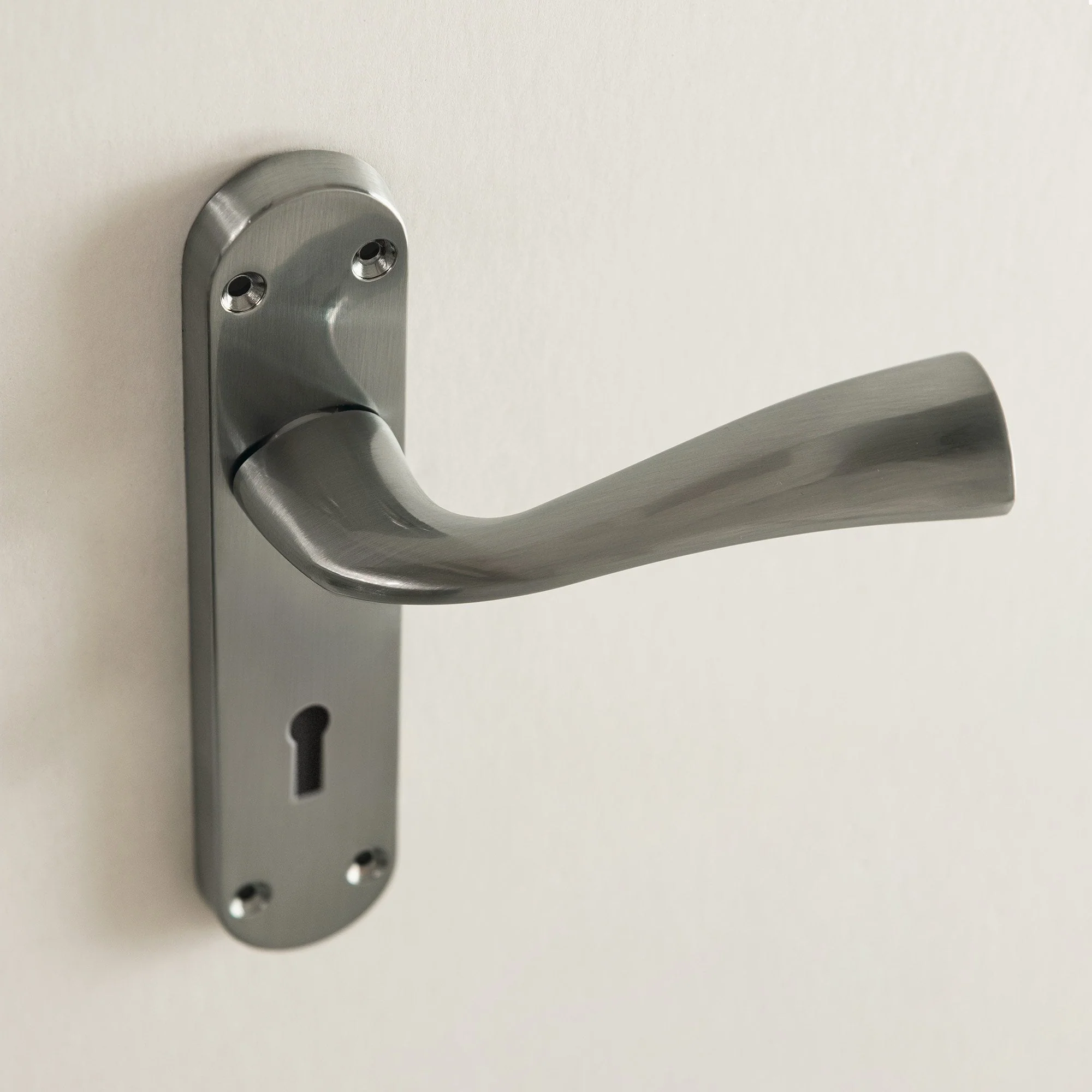 Scimitar Lever and Lock on Backplate Bathroom Door Handle Set - Satin Chrome - Image 2